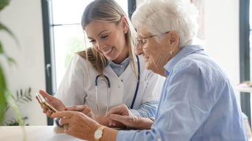 doctor smiling with elderly patient