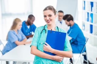 attractive-young-nurse-holding-clipboard-with-coll-2022-12-16-21-11-11-utc