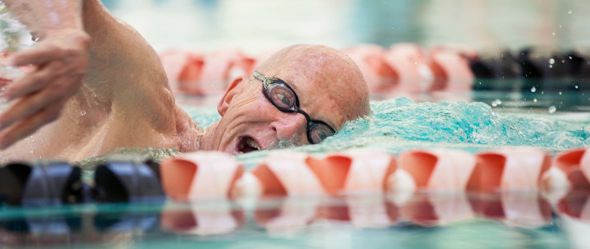 close-up-shot-of-man-in-his-mid-70s-swimming-laps-2024-12-06-03-22-01-utc