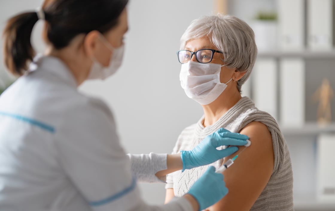doctor-giving-a-senior-woman-vaccination-2021-08-30-10-53-50-utc