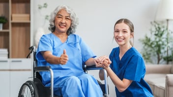 Nurse with a senior in a wheelchair
