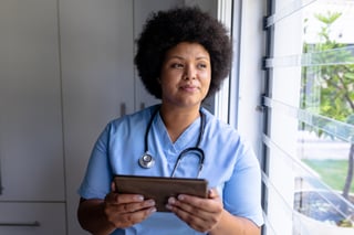 smiling-african-american-mid-adult-female-nurse-lo-2022-04-04-22-10-00-utc