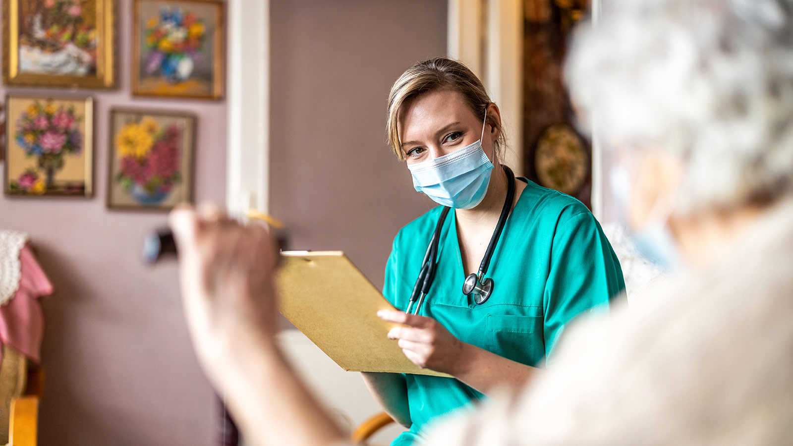 Nurse helping elderly woman