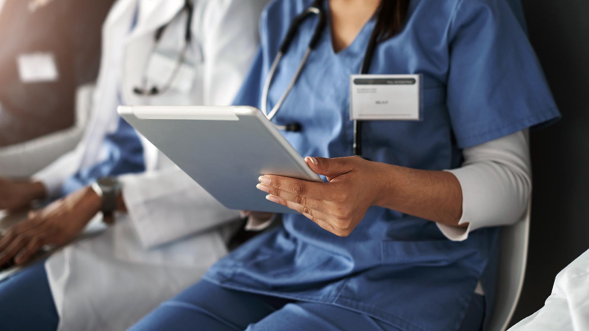 nurse hands on tablet