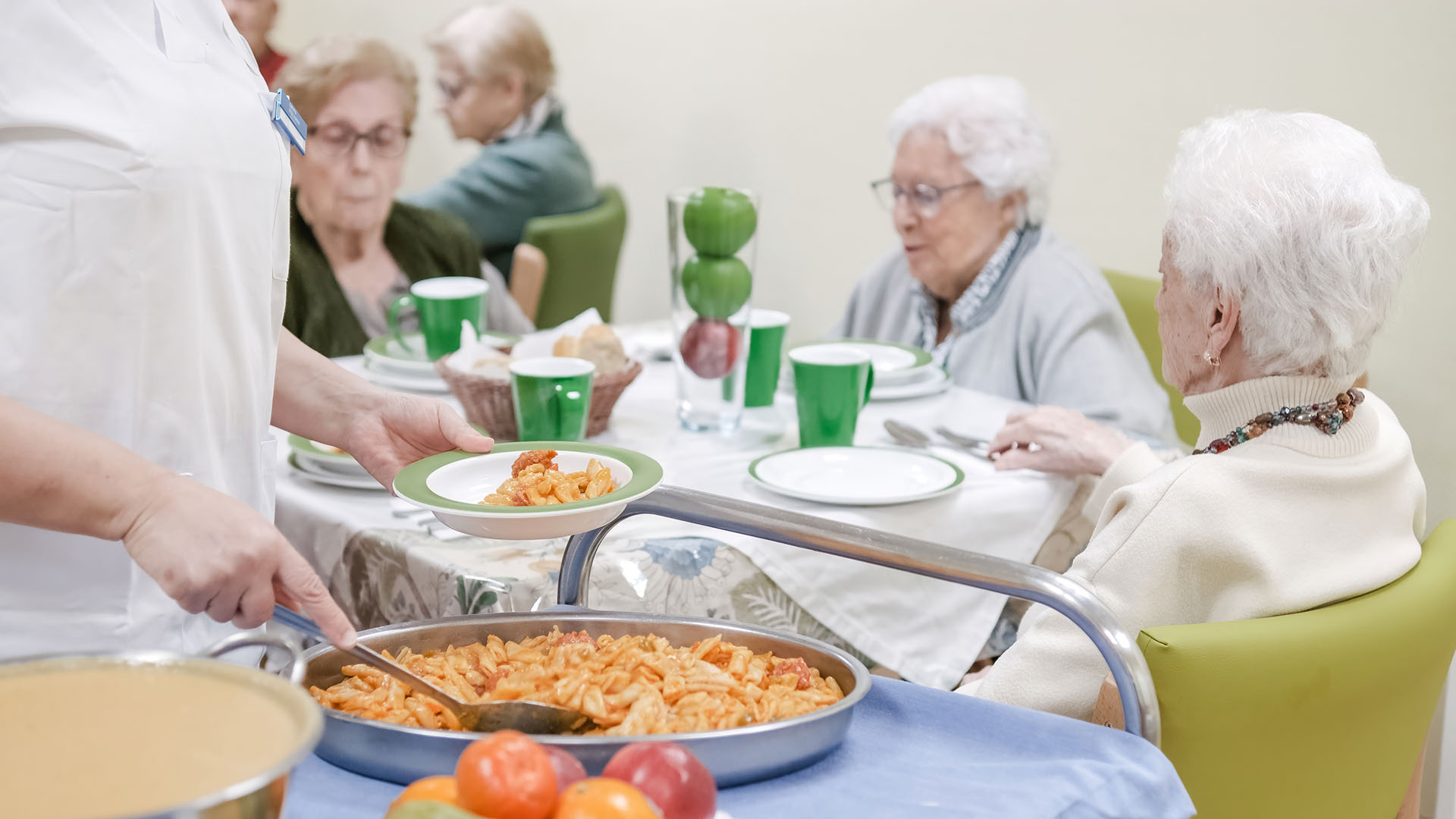 Group of seniors in a nursing home dining room