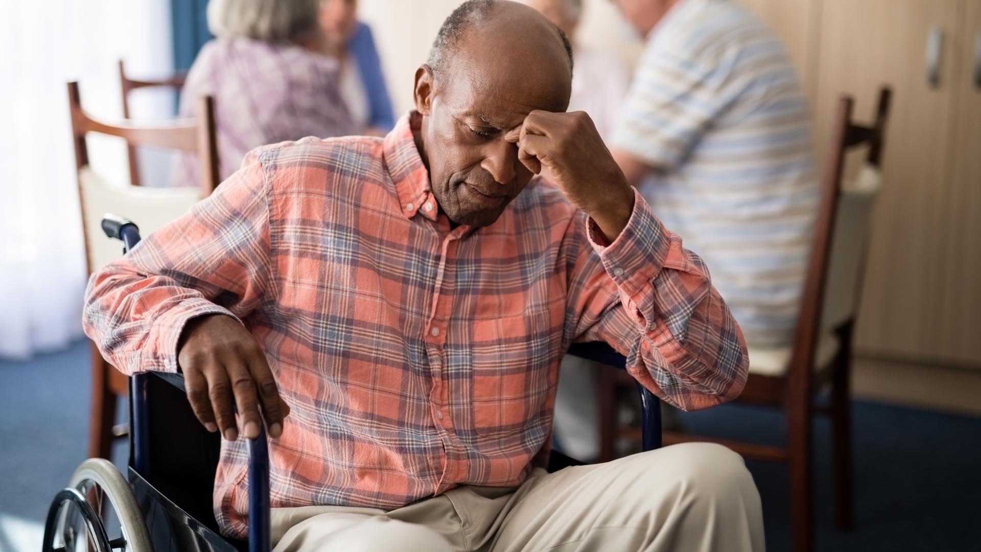 Senior with Head in Hand representing sadness or depression