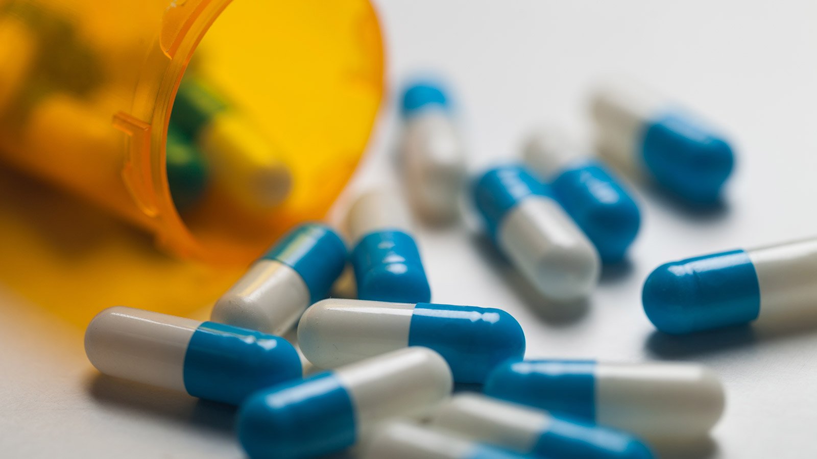 pills falling from prescription bottle