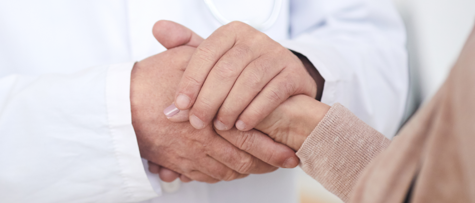 Physician comforting patient