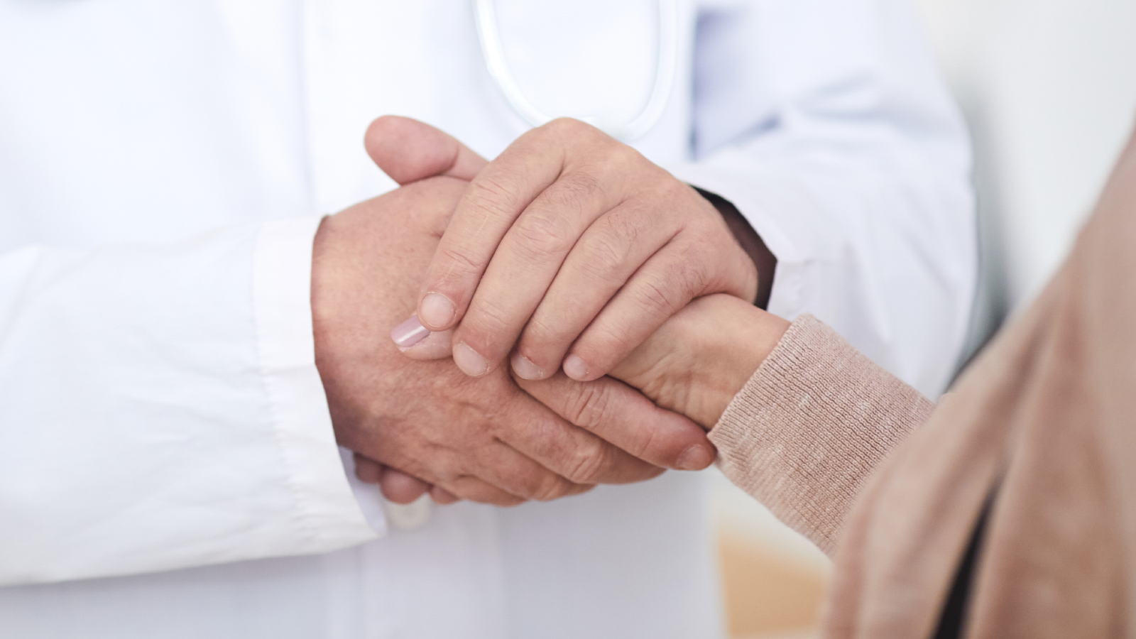 Doctor comforting patient