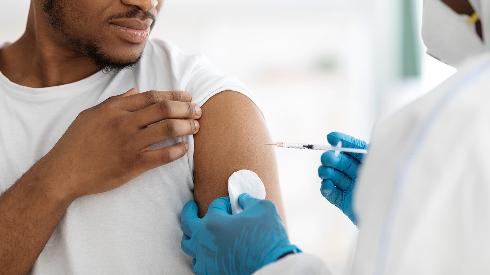 man getting covid vaccine