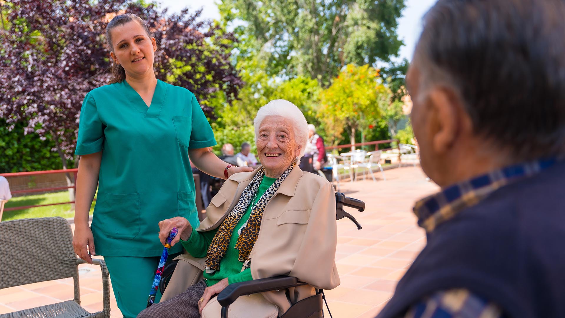 care Planning Success, nurse and resident outdoors