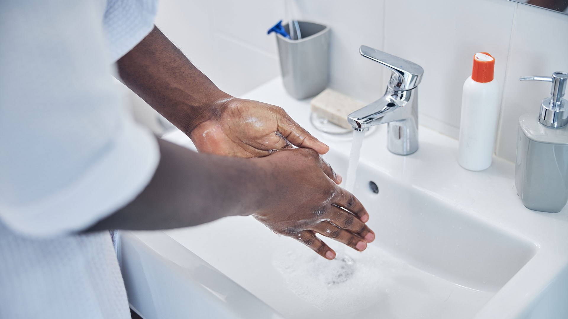 Washing hands in sink