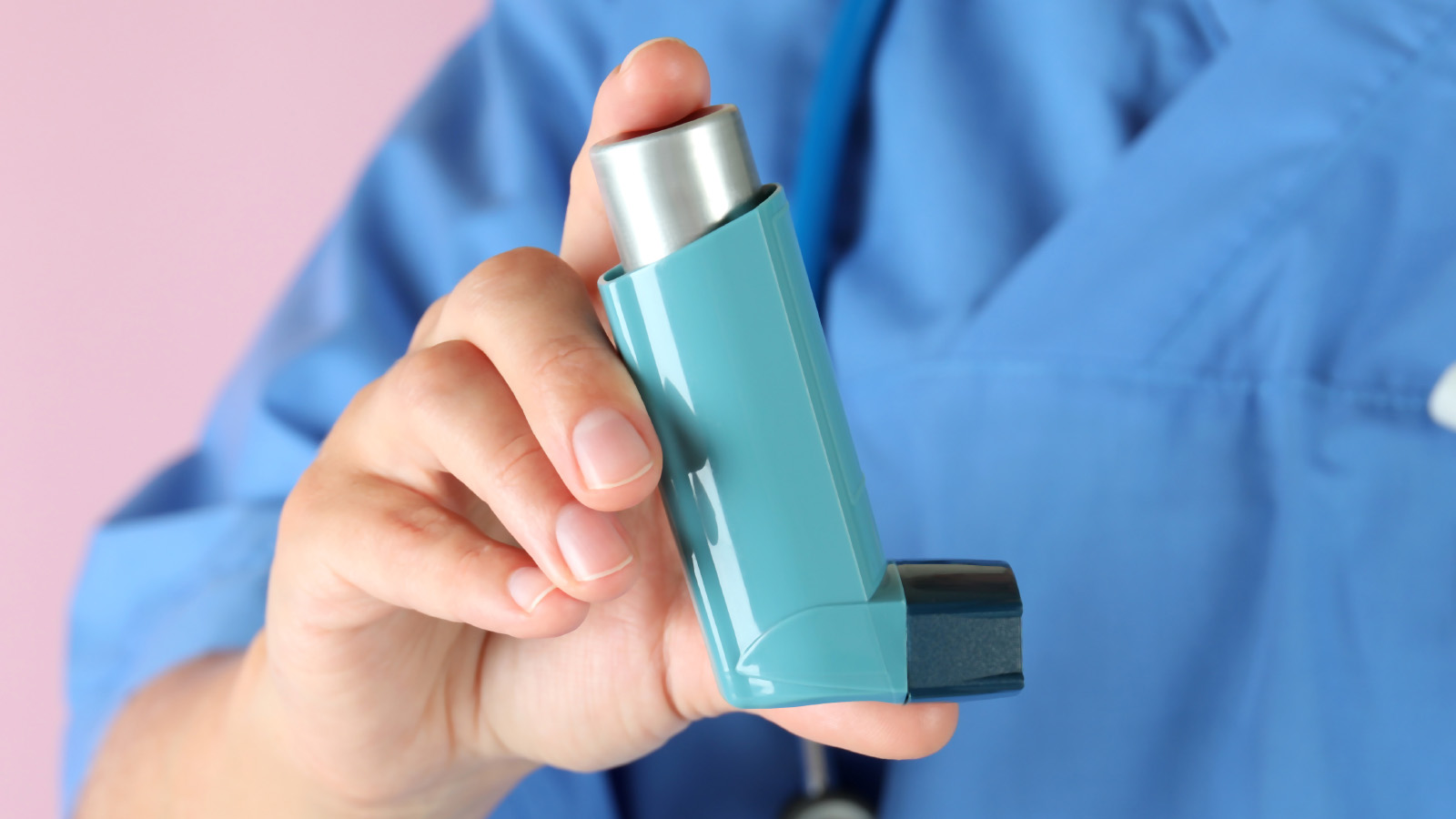 nurse holding asthma inhaler