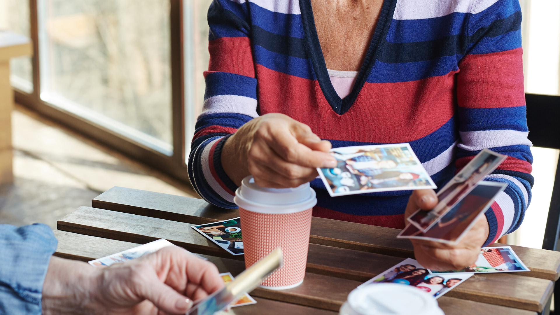 Two people looking through photographs
