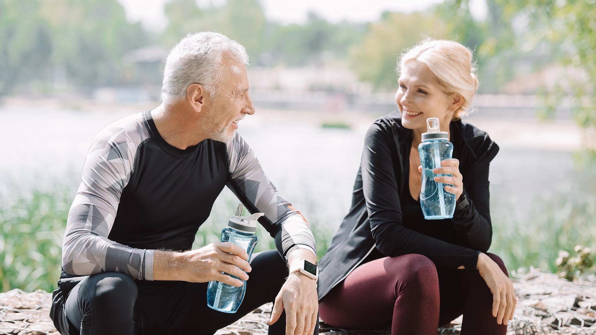 Two seniors with water bottles