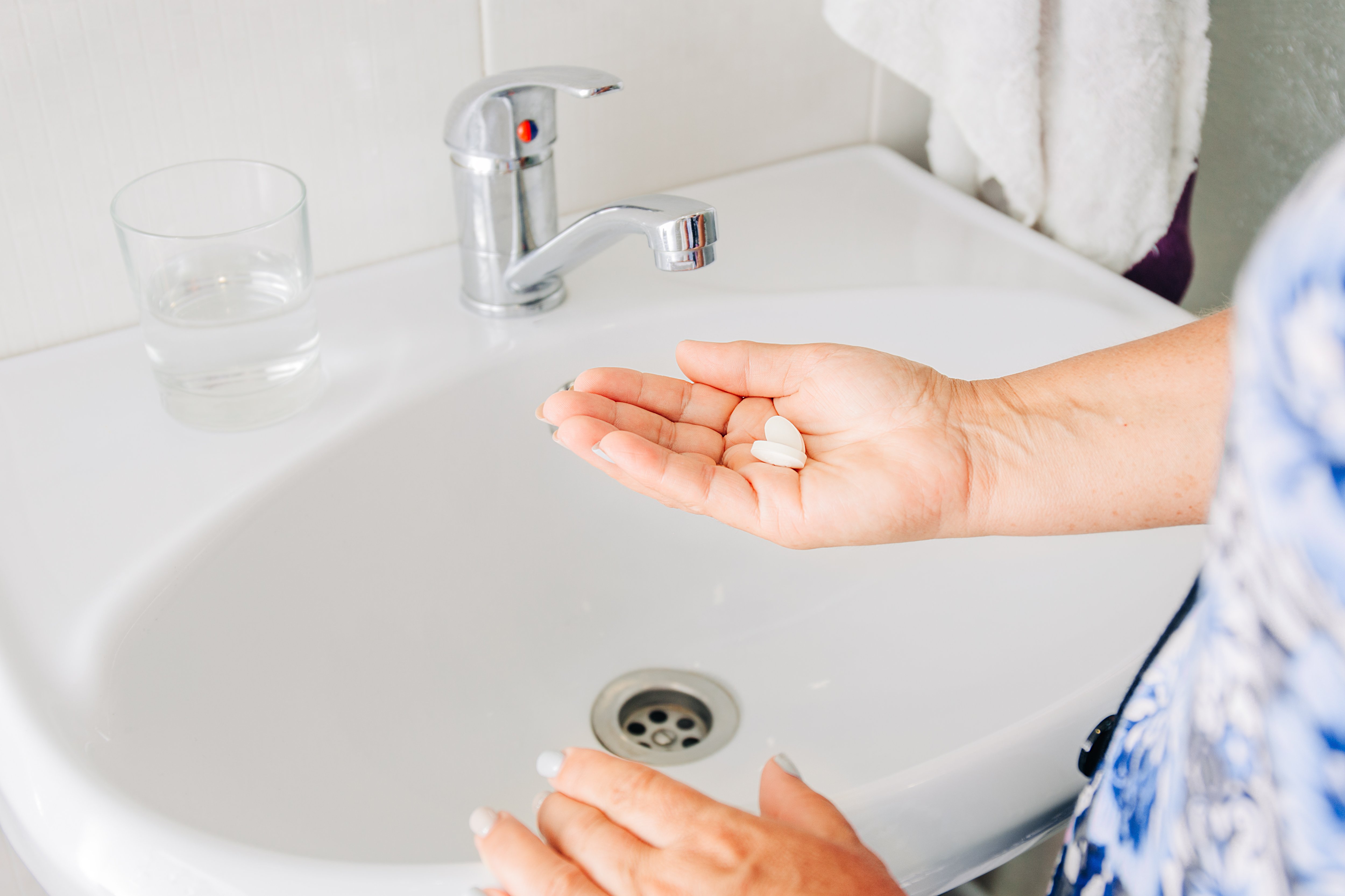 Person holding pills